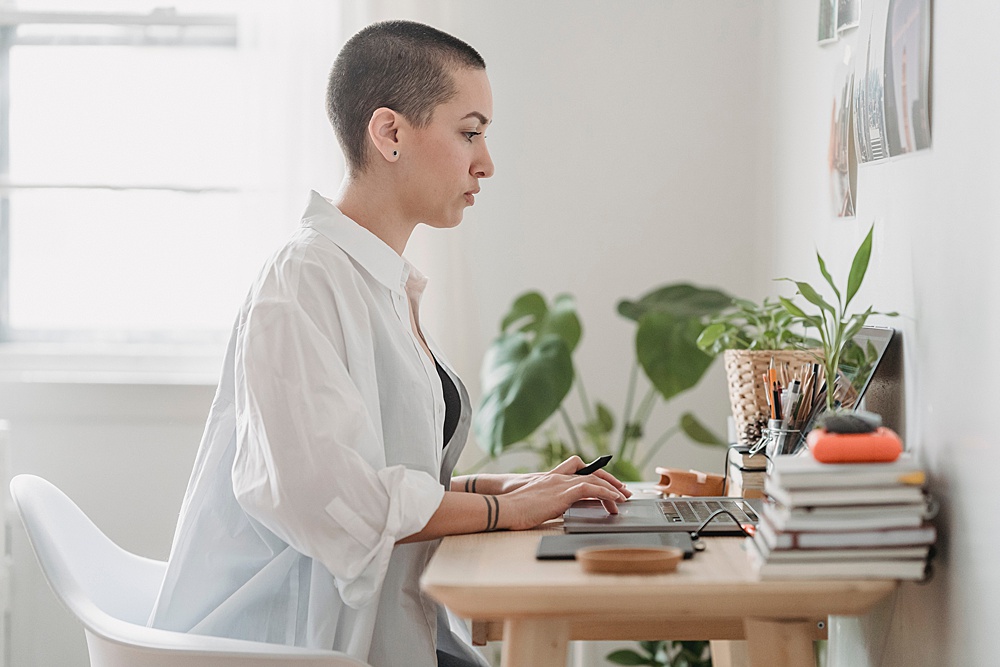 woman working on ideas for blogging on her laptop